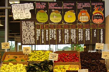 English: A display of hot peppers and a board ... English: A display of hot peppers and a board ...